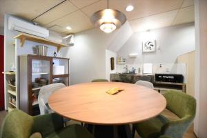 a dining room with a wooden table and chairs at BU1 瀬々串 海テラスSesekushi Umi terrace in Kagoshima
