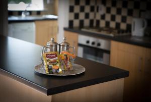 a kitchen counter with two cups on a counter top at Doolin Village Lodges in Doolin