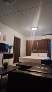 Ένα ή περισσότερα κρεβάτια σε δωμάτιο στο Popular Muang Thong Condo, Building C5