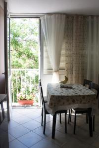 a dining room with a table with a banana on it at Apartment Dream of Split in Split