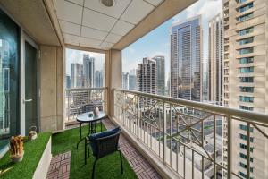 a balcony with a view of a city at White House With Burj Views, Free Parking in Dubai