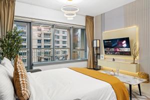 a bedroom with a large bed and a large window at White House With Burj Views, Free Parking in Dubai +51 photos