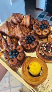 a tray of pastries and breads on a table at CASA EVA in Celano