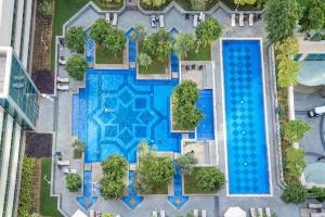 an overhead view of a swimming pool in a city at White House With Burj Views, Free Parking in Dubai