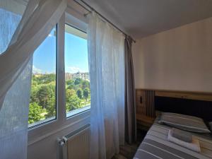 Ένα ή περισσότερα κρεβάτια σε δωμάτιο στο Best Apartament Central 2