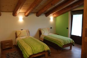 A bed or beds in a room at La Barmo Affittacamere