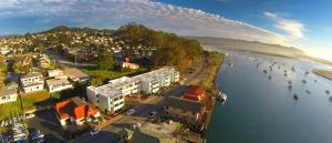 an aerial view of a city with people in the water at 456 Embarcadero Inn & Suites in Morro Bay