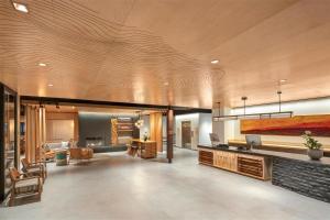 a lobby of a building with a living room at The Wildbirch Hotel - JdV by Hyatt in Anchorage