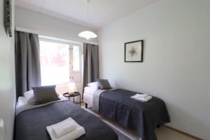 Ένα ή περισσότερα κρεβάτια σε δωμάτιο στο Forenom Serviced Apartments Vihti