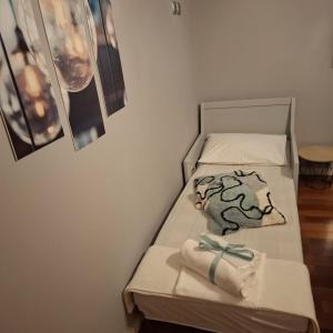 a bed with two towels on it with at Art and view-studio in Kounoupidhianá
