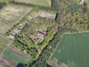 an aerial view of a house and a field at Das Blaue Haus in Groß Ippener