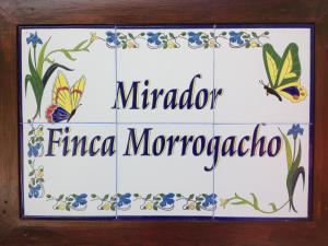 En logo, et sertifikat eller et firmaskilt på Mirador Finca Morrogacho