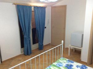 Ένα ή περισσότερα κρεβάτια σε δωμάτιο στο B&B in Residence "...a due passi dalla Scala dei Turchi"