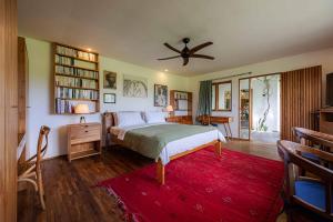 a bedroom with a bed and a ceiling fan at Villa Rice - Amazing Rice-Field VIEW 3BR Villa 9px Next To Canggu in Kerobokan