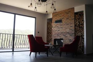 a room with chairs and a table and a brick wall at Amorium Hotel in Kastamonu +33 photos