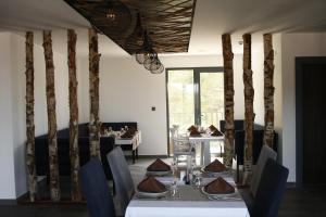 a dining room with a table and a table and chairs at Amorium Hotel in Kastamonu