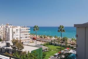 a view of the beach and the ocean from a building at Green Garden City Luxury Apartments in Alanya