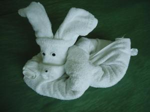 a towel animal shaped like a stuffed rabbit at Guesthouse Ruskovi in Ravda