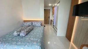 Postel nebo postele na pokoji v ubytování Apartemen Delft Unit 1115