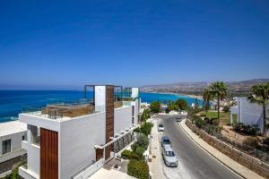a view of a building and a road at Olymp White Palace - The Ultra Luxury Beachfront House in Kissonerga