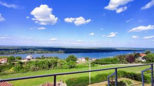 a view of a lake from the balcony of a house at House 33 in Stari Slankamen