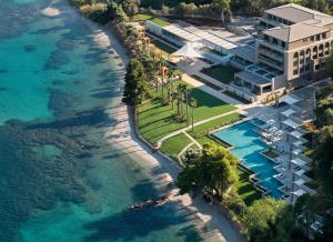 an aerial view of a resort next to the ocean at Avali, Mar-Bella Collection in Agios Ioannis Peristeron