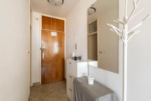 a bathroom with a sink and a table and a mirror at Apartment Princino in Dubrovnik +30 photos