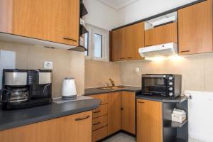 Η κουζίνα ή μικρή κουζίνα στο Ideal Apartment Close to the City Center