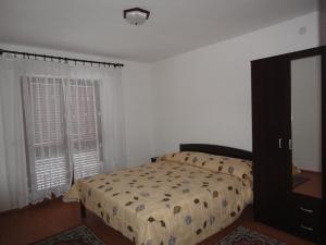 a bedroom with a bed and a window at Apartments Jadranka in Pula