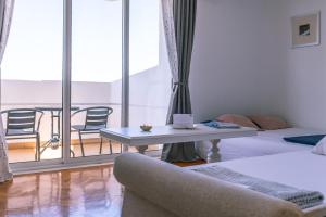 a living room with a couch and a table at Apartment Princino in Dubrovnik