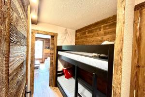 a bedroom with a bunk bed in a house at Les Cimes Blanches in Combloux +5 photos
