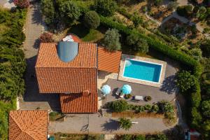 an overhead view of a house with a swimming pool at Tiny House With Private Pool Kostrena - Happy Rentals in Kostrena