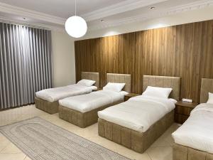 a room with three beds in a room at Apartment N6 with kitchen in Medina