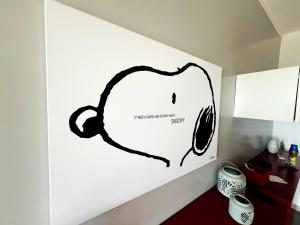a wall with a drawing of a computer mouse at Suite Vallarino 17 - Sanremo in Sanremo