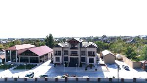 an overhead view of a building with a parking lot at Cihan Town Hotel in Zaqatala