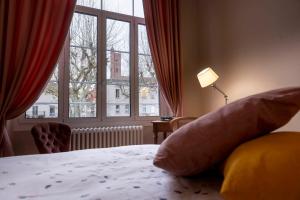 Ένα ή περισσότερα κρεβάτια σε δωμάτιο στο Chambre cosy Blche1- Centre-Ville