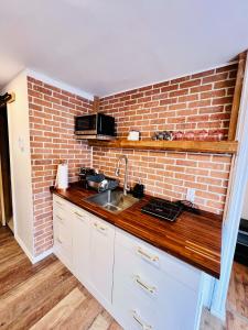Η κουζίνα ή μικρή κουζίνα στο 564B - Le Refuge Spa Riviere +19 φωτογραφίες