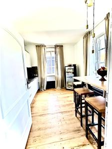 a kitchen with a table and a dining room at Adlershof in Hemmersheim +25 photos