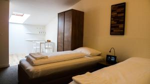 Postel nebo postele na pokoji v ubytování A7 Apartments