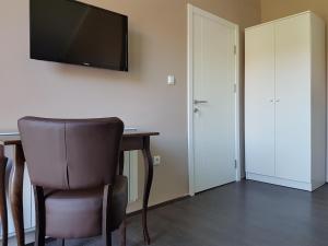 TV in/ali zabaviščno središče v nastanitvi Apartmani Simić Valjevo