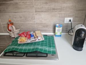 a kitchen counter with a tray of food on it at Home Sweet Home in Guarrato