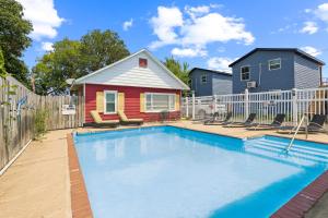 a swimming pool in front of a house at Dave's Last Resort Poolside-Comforting Cabin 2 Hotel Room in Monticello