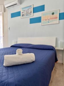 Ένα ή περισσότερα κρεβάτια σε δωμάτιο στο Casa Ferruccio - Parking - Air Conditioning - WiFi