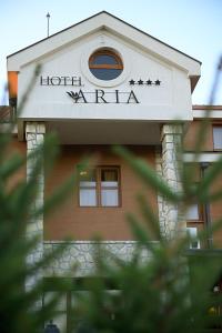 a hotel waikiki sign on top of a building at Hotel Aria in Podgorica