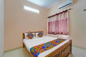 Postel nebo postele na pokoji v ubytování Via Praneeth Residency + 25 fotografií