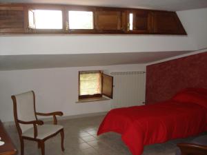 A bed or beds in a room at Agriturismo La Fattoria