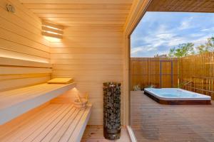 a sauna with a hot tub on a wooden deck at Natur Harmony Tiszafüred in Tiszafüred