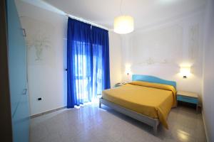 Postel nebo postele na pokoji v ubytování Hotel Albatros