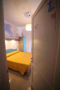 Postel nebo postele na pokoji v ubytování Hotel Albatros