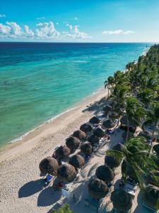 an aerial view of a beach with umbrellas and the ocean at Grand Sunset Princess - All Inclusive in Playa del Carmen